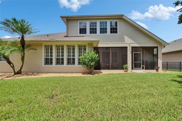 8704 Winsome Way, Land O Lakes, FL 34637 - back of property featuring stucco siding and a sunroom