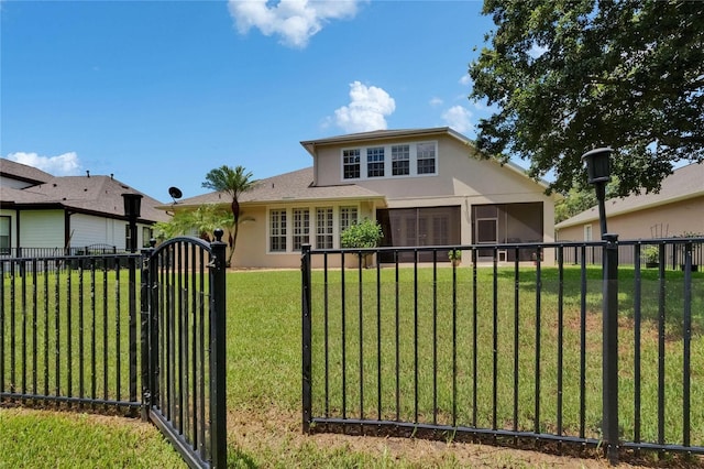 8704 Winsome Way, Land O Lakes, FL 34637 - view of front of home with a gate, stucco siding, and a sunroom