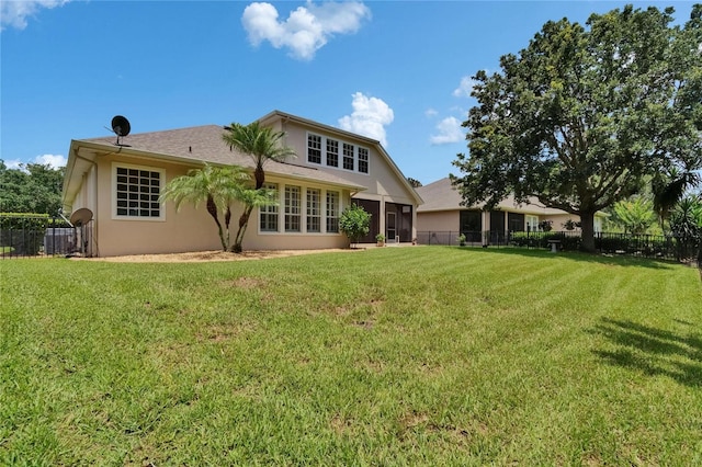8704 Winsome Way, Land O Lakes, FL 34637 - back of property with stucco siding and a sunroom