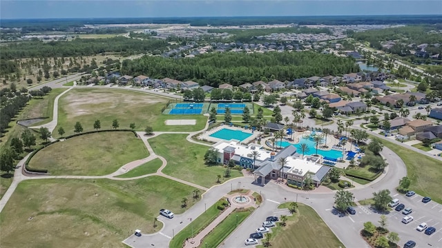 8704 Winsome Way, Land O Lakes, FL 34637 - aerial view of property and surrounding area with a pool area and nearby suburban area