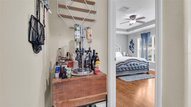 7120 Forest Mere Dr, Riverview, FL 33578 - bedroom featuring wood finished floors and a raised ceiling