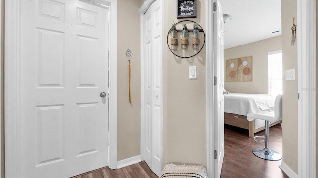 7120 Forest Mere Dr, Riverview, FL 33578 - corridor featuring dark wood-type flooring and baseboards