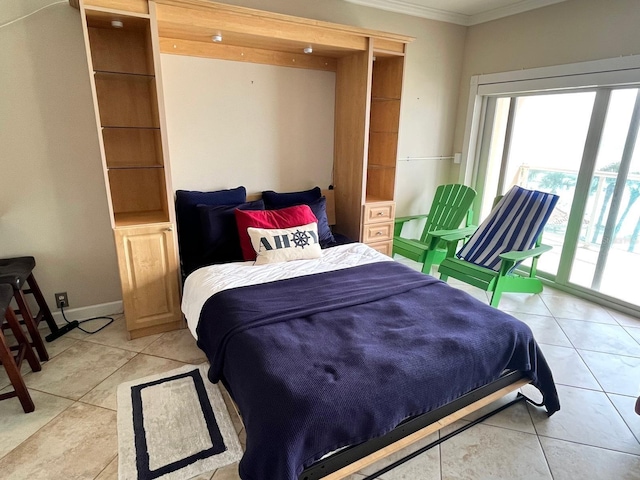 880 Mandalay Ave Unit N311, Clearwater Beach, FL 33767 - bedroom with ornamental molding and light tile patterned floors