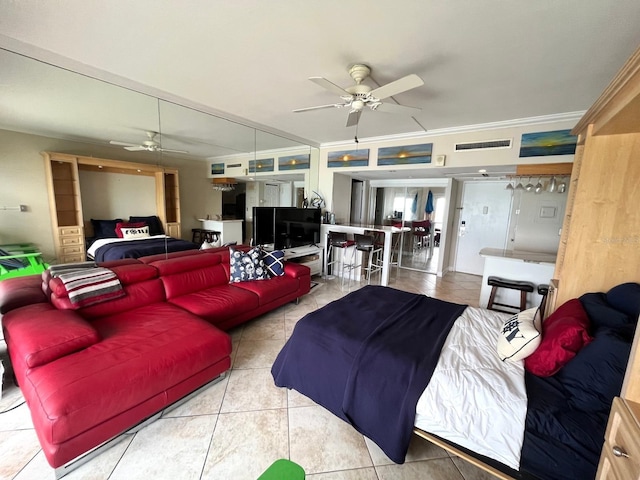880 Mandalay Ave Unit N311, Clearwater Beach, FL 33767 - tiled living area with ceiling fan and crown molding