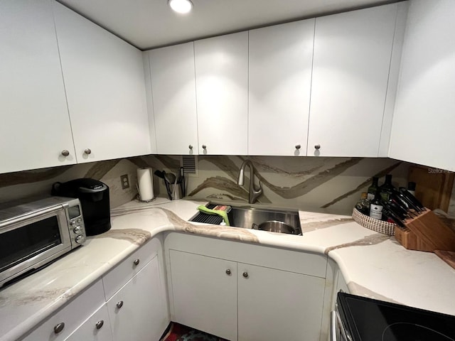 880 Mandalay Ave Unit N311, Clearwater Beach, FL 33767 - kitchen with appliances with stainless steel finishes and white cabinets