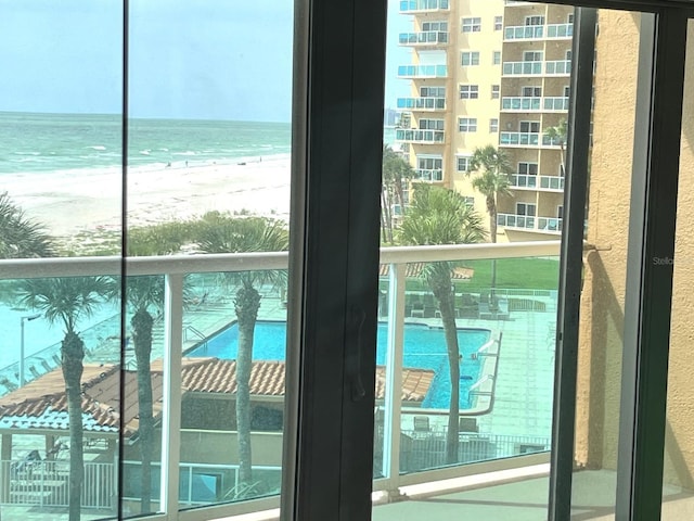 880 Mandalay Ave Unit N311, Clearwater Beach, FL 33767 - doorway featuring view of water and beach and plenty of natural light