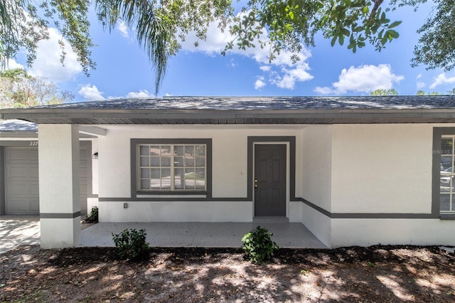 22716 Penny Loop, Land O Lakes, FL 34639 - entrance to property with stucco siding and a garage