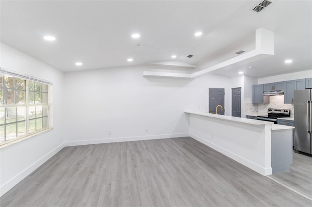 22716 Penny Loop, Land O Lakes, FL 34639 - unfurnished living room with recessed lighting and light wood finished floors