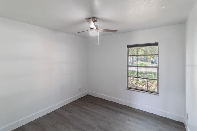 22716 Penny Loop, Land O Lakes, FL 34639 - unfurnished room with dark wood-style flooring, a ceiling fan, and a textured ceiling