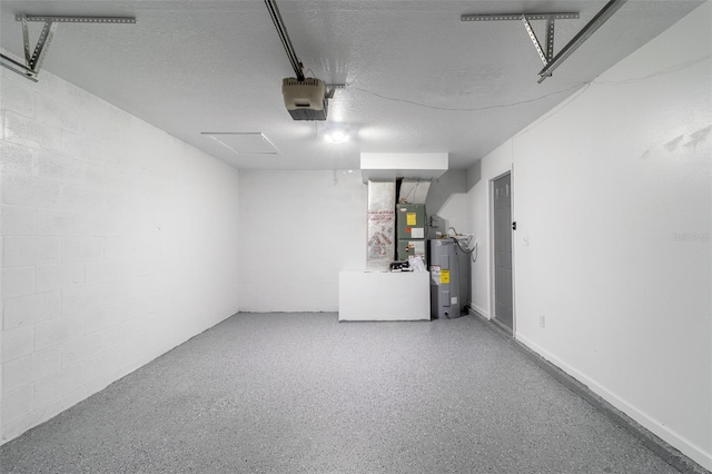 22716 Penny Loop, Land O Lakes, FL 34639 - garage with electric water heater, a garage door opener, concrete block wall, and heating unit