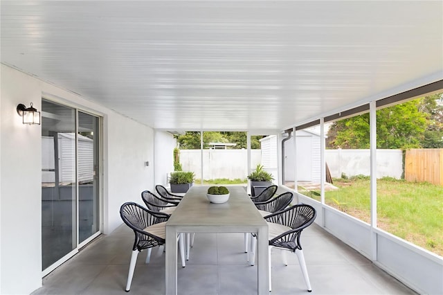 22716 Penny Loop, Land O Lakes, FL 34639 - sunroom / solarium featuring outdoor dining space