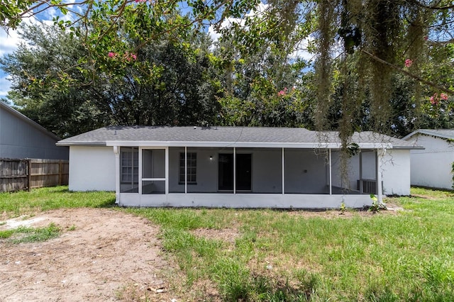 22716 Penny Loop, Land O Lakes, FL 34639 - rear view of property featuring a sunroom and stucco siding