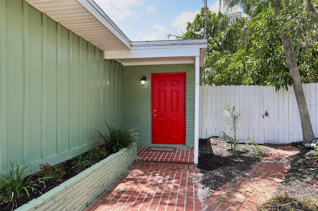 607 E River Dr, Temple Terrace, FL 33617 - property entrance with board and batten siding and brick siding