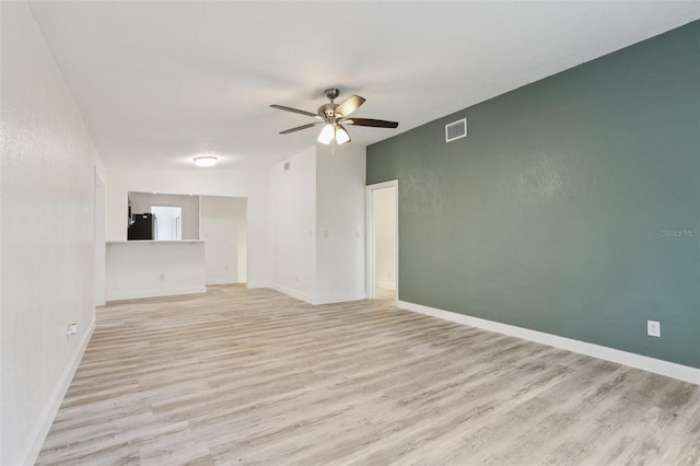 607 E River Dr, Temple Terrace, FL 33617 - empty room featuring light wood-style flooring and ceiling fan
