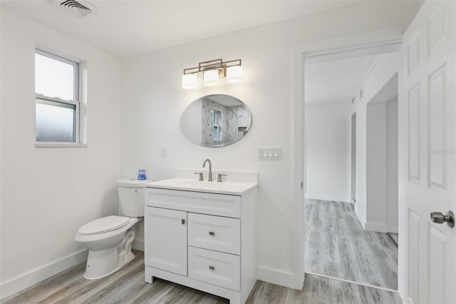 607 E River Dr, Temple Terrace, FL 33617 - bathroom featuring wood finished floors and vanity