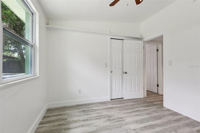 607 E River Dr, Temple Terrace, FL 33617 - unfurnished bedroom featuring a closet, wood finished floors, and a ceiling fan