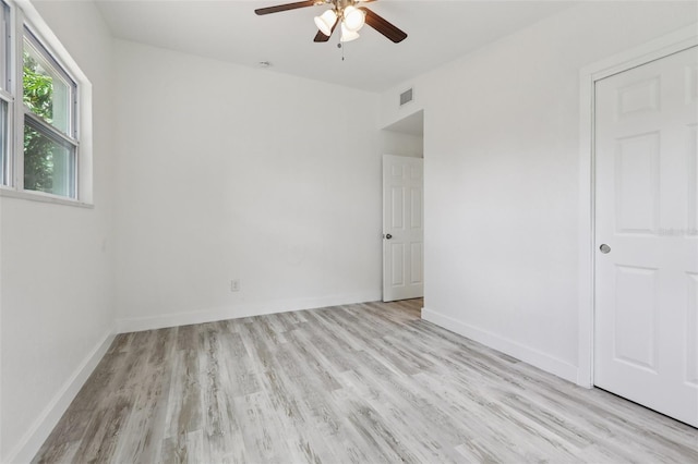 607 E River Dr, Temple Terrace, FL 33617 - empty room featuring a ceiling fan and light wood-style floors