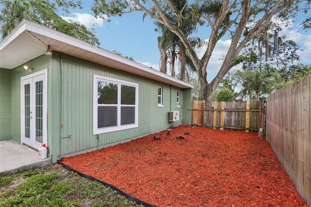 607 E River Dr, Temple Terrace, FL 33617 - fenced backyard with french doors