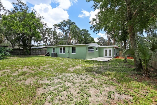 607 E River Dr, Temple Terrace, FL 33617 - rear view of property featuring french doors and a patio