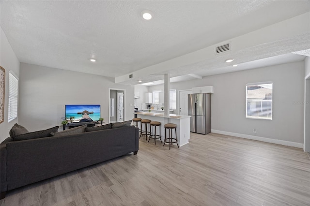 1048 W Lime St, Lakeland, FL 33815 - living area featuring light wood-style floors, recessed lighting, and a textured ceiling