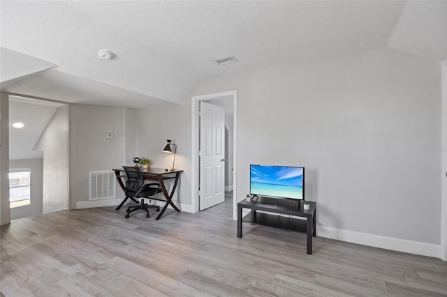 1048 W Lime St, Lakeland, FL 33815 - living area with lofted ceiling, a desk, wood finished floors, and recessed lighting