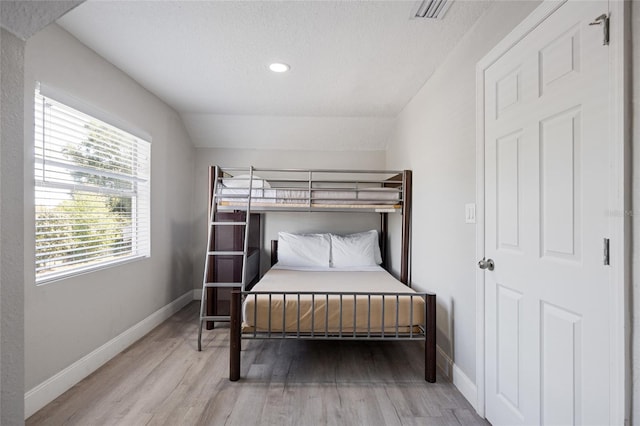 1048 W Lime St, Lakeland, FL 33815 - bedroom with wood finished floors and recessed lighting