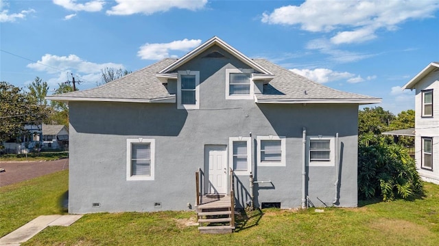 1048 W Lime St, Lakeland, FL 33815 - back of house featuring stucco siding, a yard, crawl space, and roof with shingles