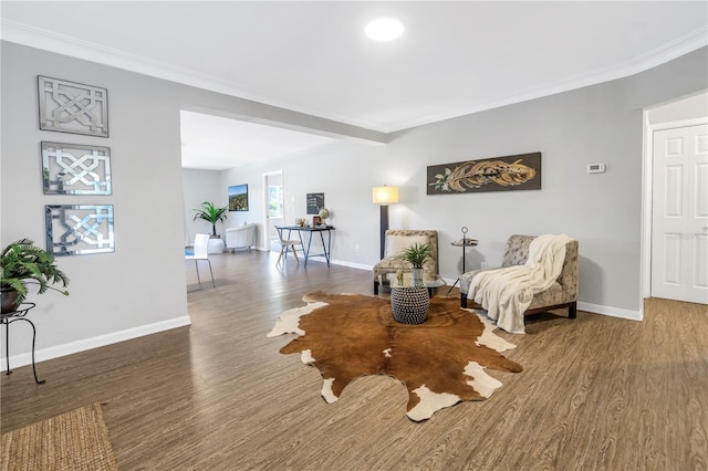 610 Cordova Blvd NE, Saint Petersburg, FL 33704 - sitting room with wood finished floors and ornamental molding