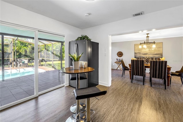 610 Cordova Blvd NE, Saint Petersburg, FL 33704 - dining area featuring wood finished floors and baseboards