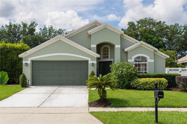 643 Blenheim Loop, Winter Springs, FL 32708 - view of front of home featuring a garage, driveway, and stucco siding