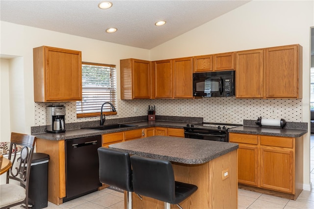 643 Blenheim Loop, Winter Springs, FL 32708 - kitchen with black appliances, a kitchen island, tasteful backsplash, dark countertops, and lofted ceiling