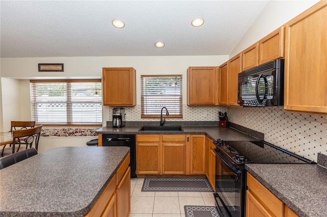 643 Blenheim Loop, Winter Springs, FL 32708 - kitchen with black appliances, dark countertops, light tile patterned floors, tasteful backsplash, and a textured ceiling
