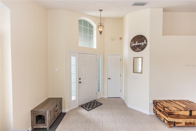 643 Blenheim Loop, Winter Springs, FL 32708 - foyer with a high ceiling and light tile patterned flooring