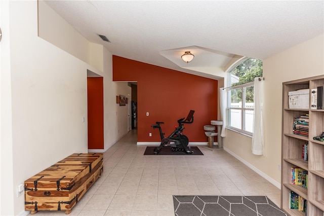 643 Blenheim Loop, Winter Springs, FL 32708 - exercise room featuring light tile patterned floors and lofted ceiling