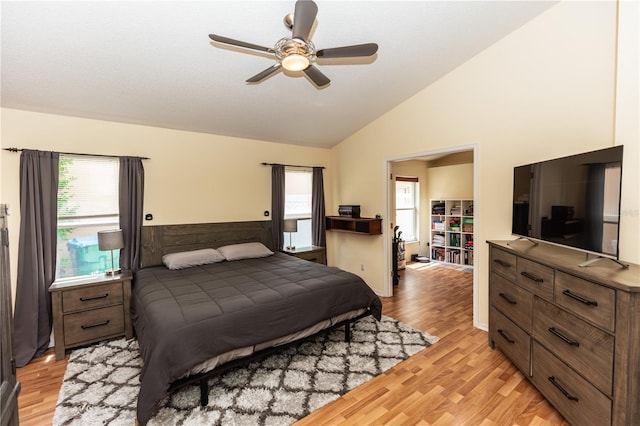 643 Blenheim Loop, Winter Springs, FL 32708 - bedroom with multiple windows, light wood finished floors, wainscoting, ceiling fan, and high vaulted ceiling