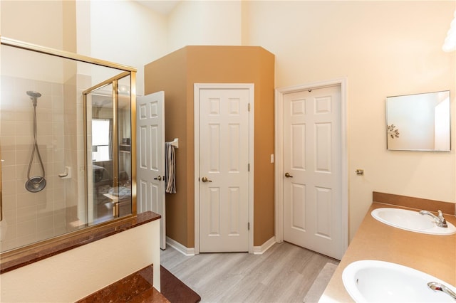 643 Blenheim Loop, Winter Springs, FL 32708 - full bath with a stall shower, wood finished floors, double vanity, and a towering ceiling