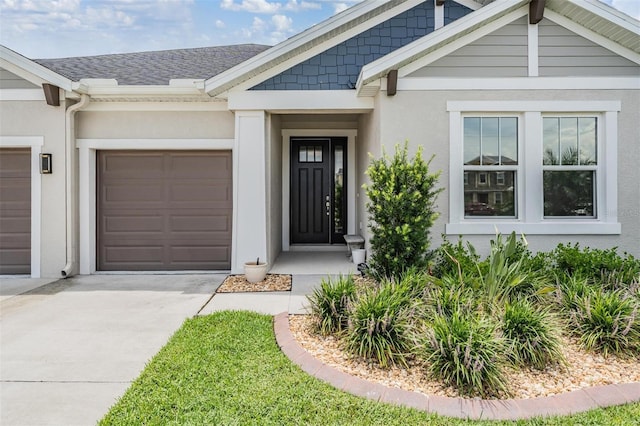 6879 Talamore Dr, Wesley Chapel, FL 33545 - entrance to property with stucco siding, driveway, a garage, and roof with shingles
