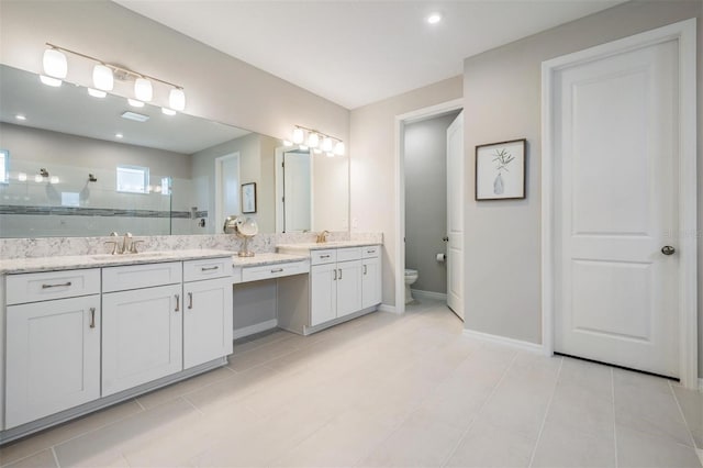 6879 Talamore Dr, Wesley Chapel, FL 33545 - bathroom featuring vanity, a walk in shower, and tile patterned floors