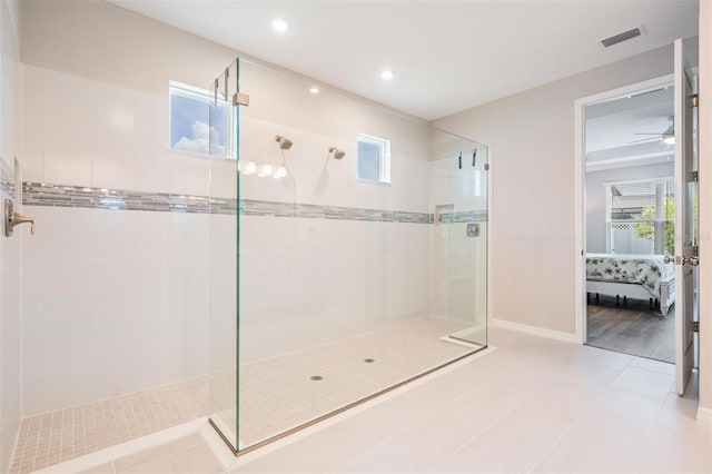 6879 Talamore Dr, Wesley Chapel, FL 33545 - ensuite bathroom with walk in shower, healthy amount of natural light, recessed lighting, ceiling fan, and tile patterned flooring