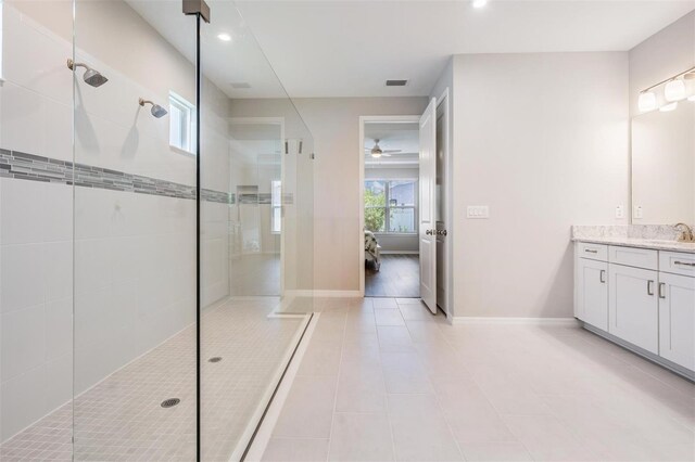 6879 Talamore Dr, Wesley Chapel, FL 33545 - bathroom featuring vanity, walk in shower, connected bathroom, a ceiling fan, and recessed lighting