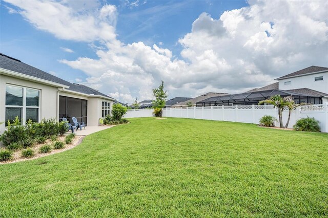 6879 Talamore Dr, Wesley Chapel, FL 33545 - fenced backyard featuring a patio