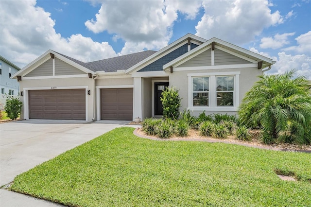 6879 Talamore Dr, Wesley Chapel, FL 33545 - view of front of home featuring stucco siding, driveway, a garage, and a front yard