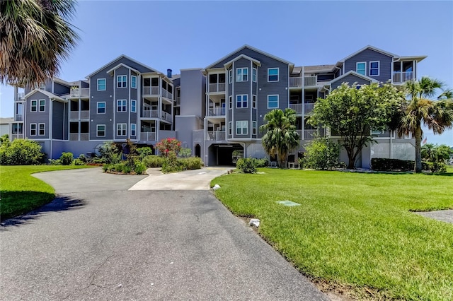 5722 Biscayne Ct Unit 107, New Port Richey, FL 34652 - view of apartment building / complex featuring driveway