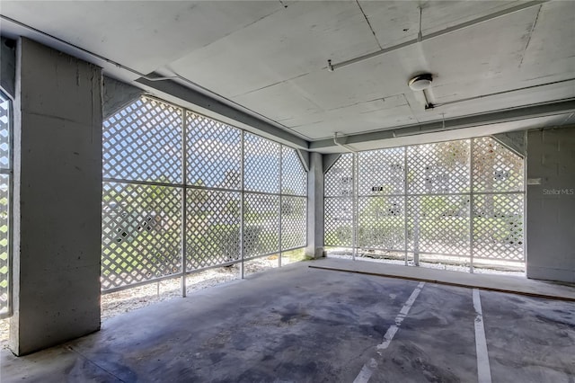 5722 Biscayne Ct Unit 107, New Port Richey, FL 34652 - unfurnished sunroom featuring plenty of natural light