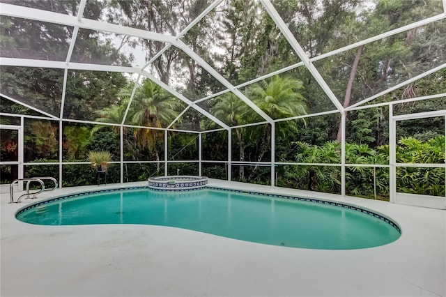 1827 Foxboro Ct, Oldsmar, FL 34677 - view of swimming pool with a pool with connected hot tub, a lanai, and a patio