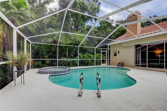 1827 Foxboro Ct, Oldsmar, FL 34677 - view of swimming pool with a patio and a pool with connected hot tub
