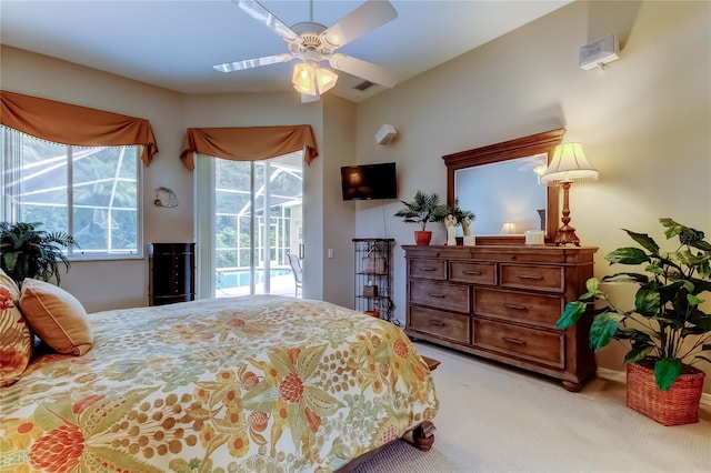 1827 Foxboro Ct, Oldsmar, FL 34677 - bedroom featuring access to outside, light colored carpet, multiple windows, and ceiling fan