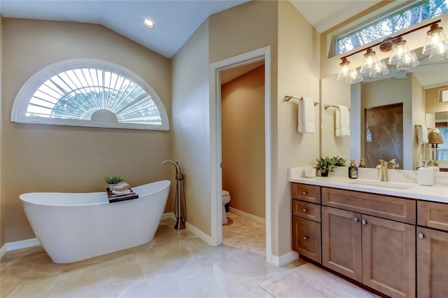 1827 Foxboro Ct, Oldsmar, FL 34677 - bathroom with vanity, a freestanding bath, lofted ceiling, and recessed lighting