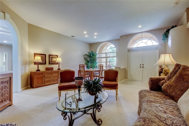 1827 Foxboro Ct, Oldsmar, FL 34677 - living room with light carpet, arched walkways, and recessed lighting