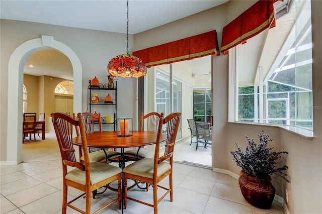 1827 Foxboro Ct, Oldsmar, FL 34677 - dining space with light tile patterned flooring and arched walkways